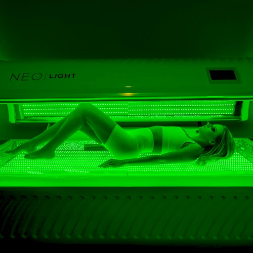 Neobed bed lit in green light