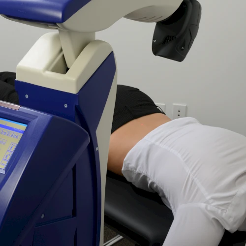MLS M6 laser applied to a client's back